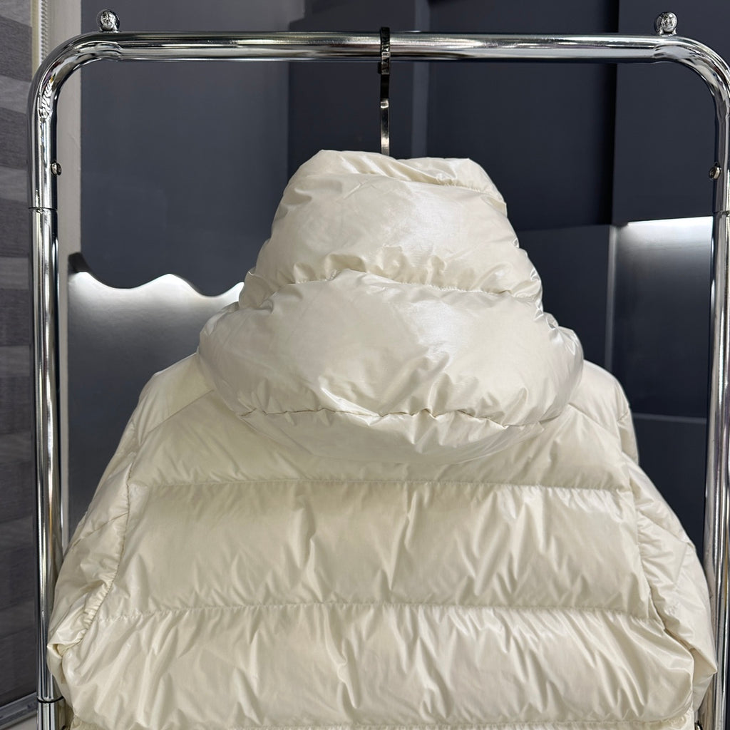 Moncler long puffer jacket close-up on hood, light cream quilted padding