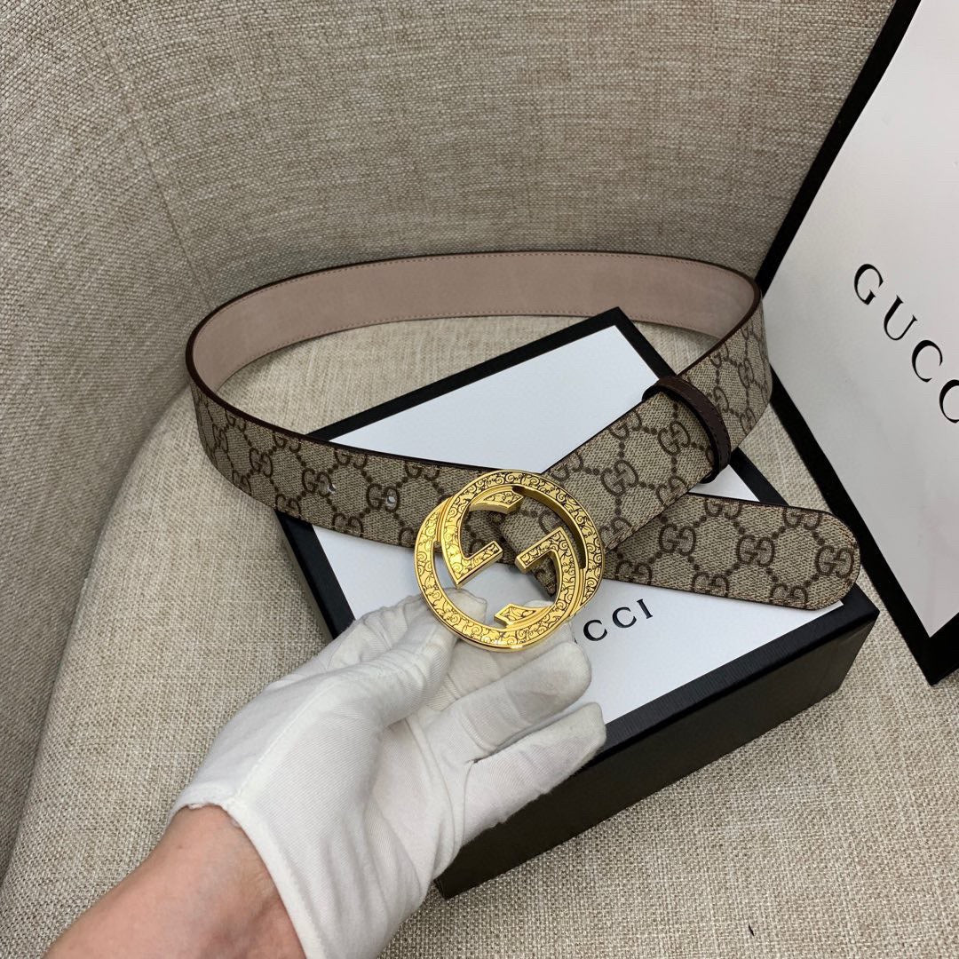 Gucci belt with GG monogram canvas strap and gold-tone G buckle, brown leather lining.
