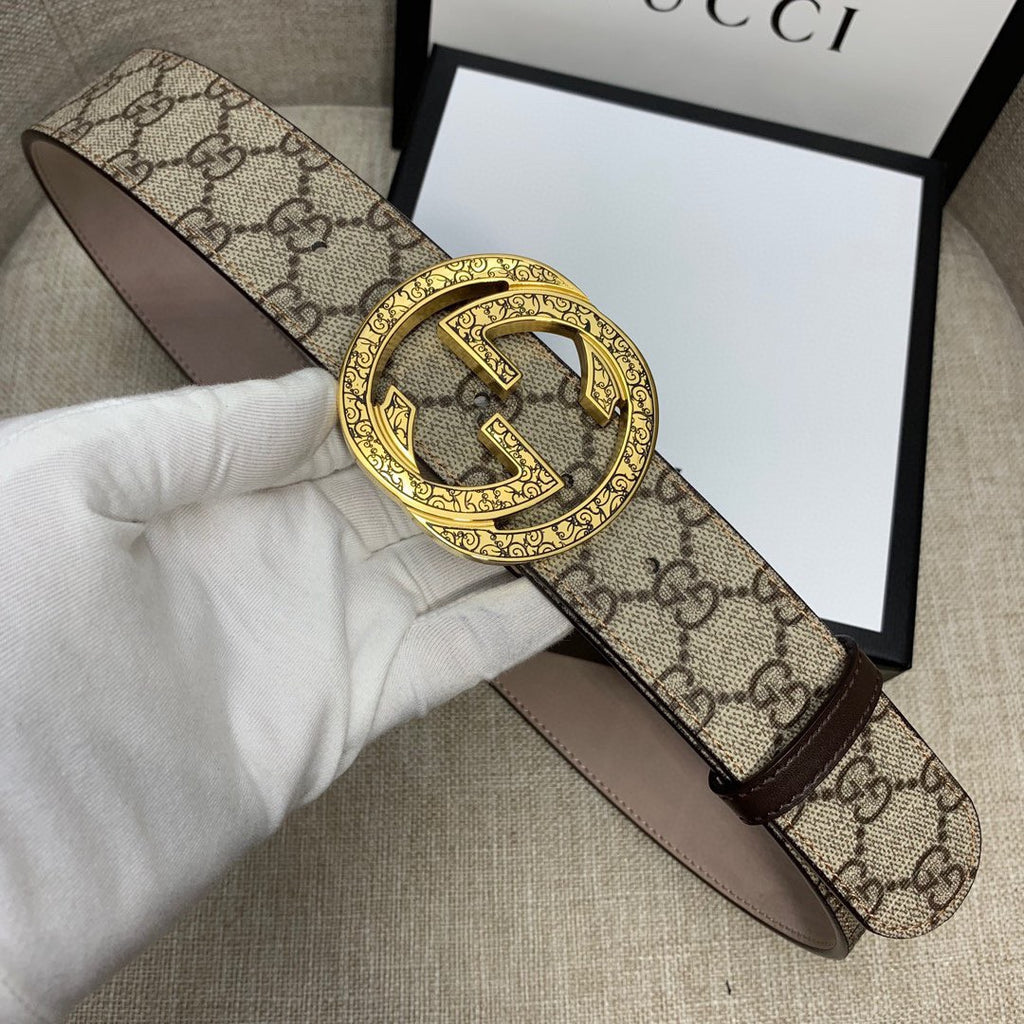 Gucci belt with GG monogram canvas and gold-tone G buckle, brown leather trim.