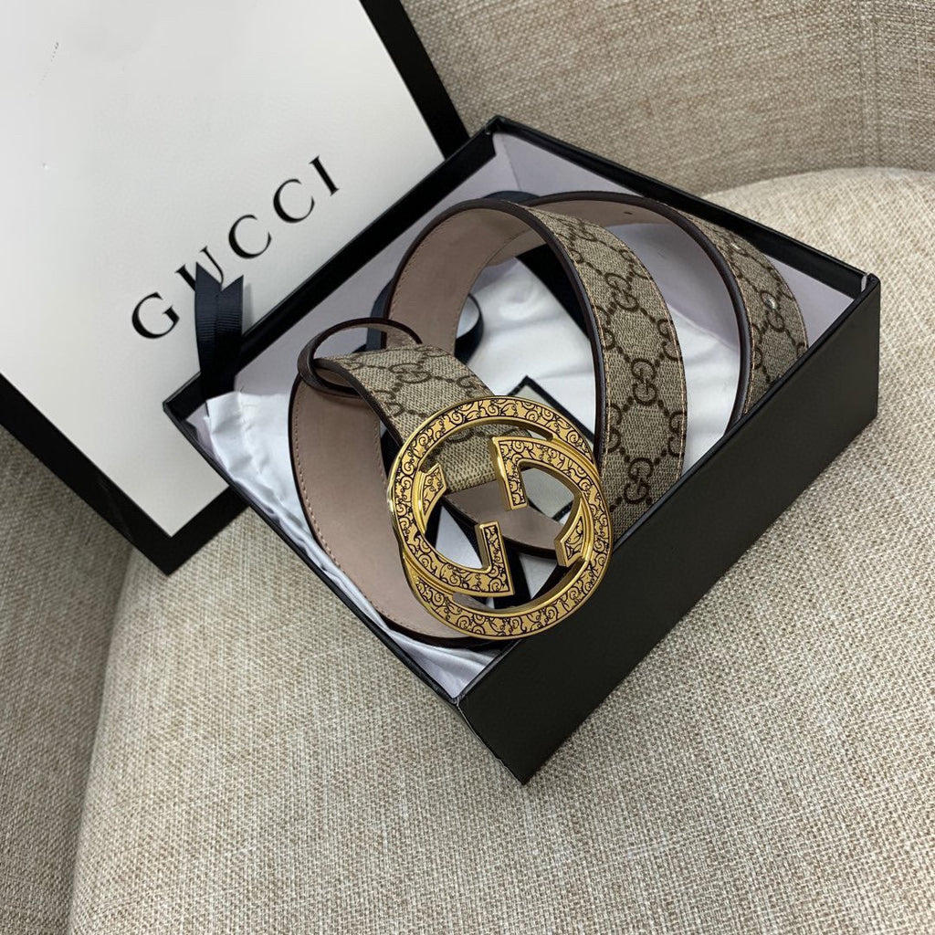 Gucci belt with GG monogram canvas strap and gold-tone G buckle, brown leather trim.