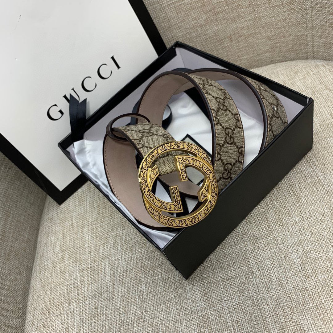 Gucci belt with GG monogram canvas strap and gold-tone G buckle, brown leather trim.