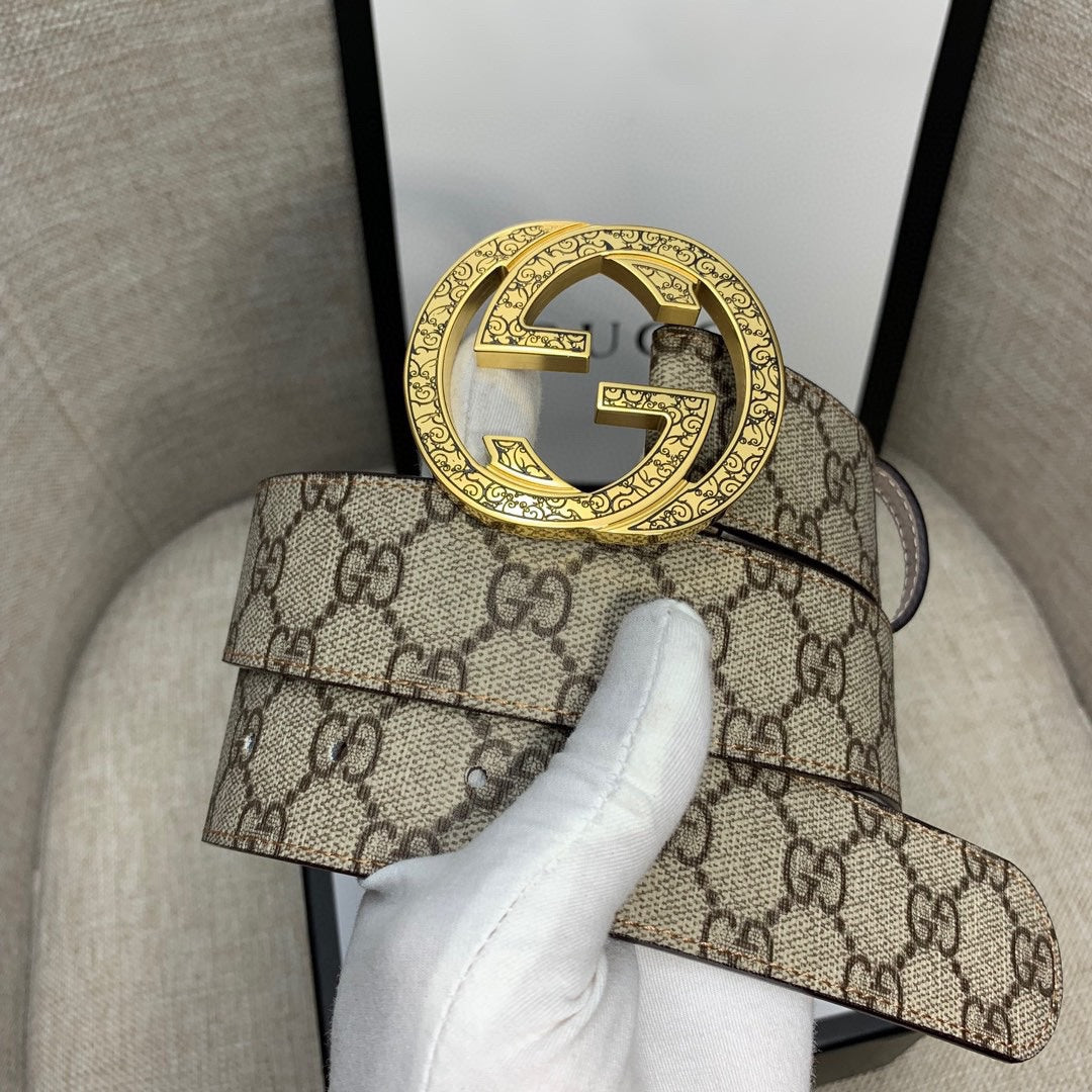 Gucci belt with GG monogram canvas and large gold-tone G buckle, brown leather edging.