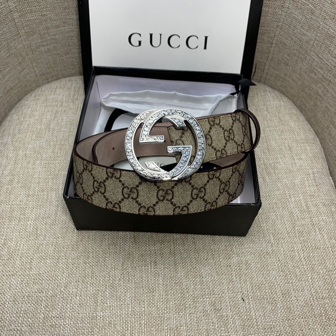Gucci GG canvas belt with silver G buckle and dark brown leather strap