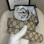 Gucci GG canvas belt with circular silver-toned G buckle and dark strap