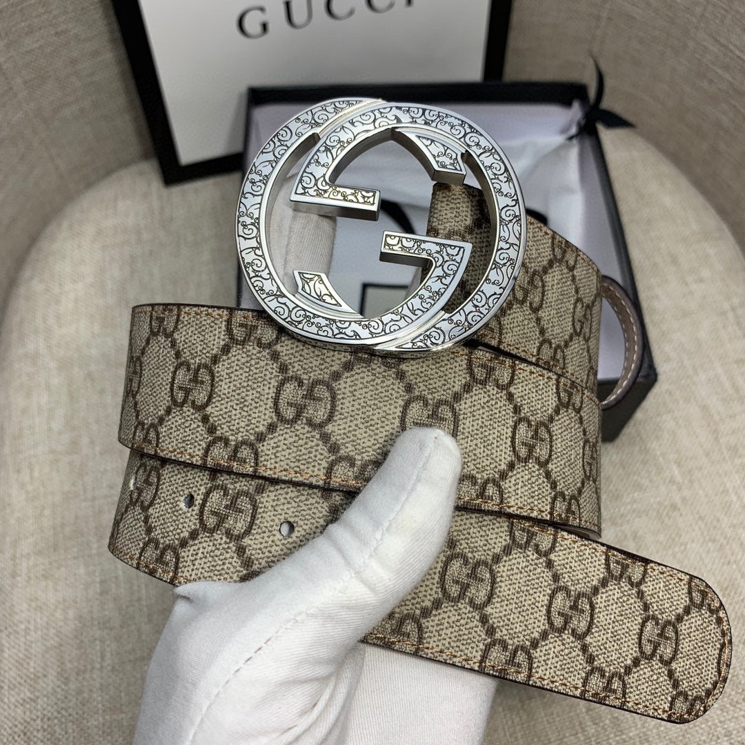 Gucci GG canvas belt with circular silver-toned G buckle and dark strap