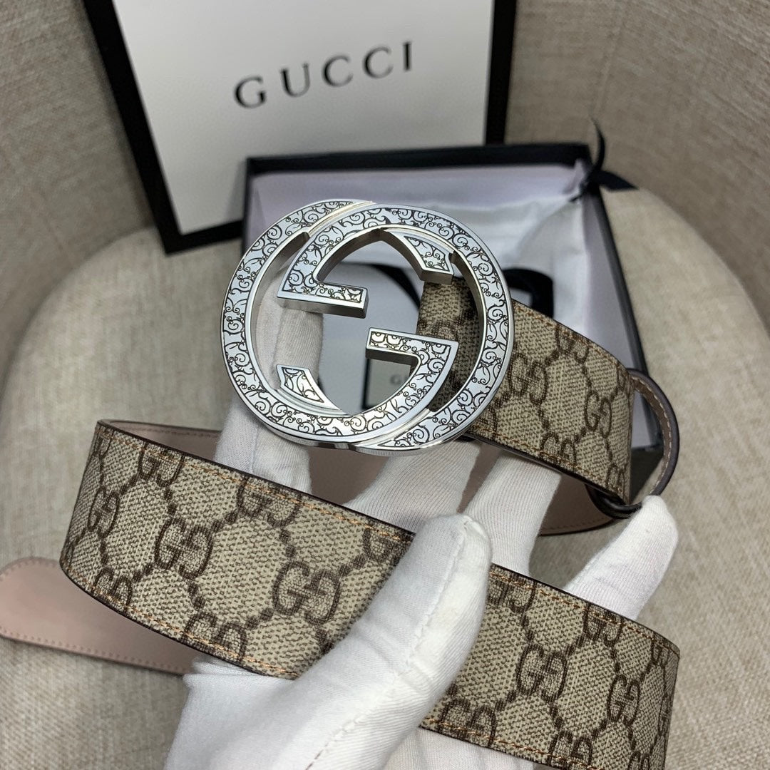 Gucci GG canvas belt with silver-toned G buckle and dark brown leather strap