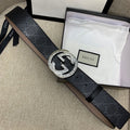 Gucci belt, dark GG canvas with silver double-G buckle and tan leather lining.