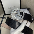 Belt with dark GG canvas and silver double-G buckle, beige underside strap.