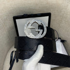Belt side view: dark GG canvas strap with silver double-G buckle and loop.
