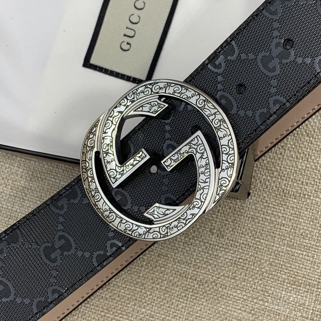 Belt buckle close-up: silver double-G medallion on dark GG canvas strap.