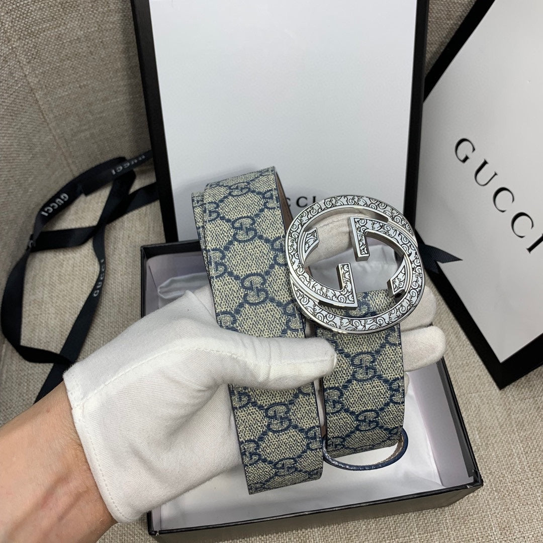 Gucci belt with blue GG canvas strap and silver-tone logo buckle, lifted