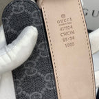 Gucci belt size label on inner strap, beige leather tab with printed codes.