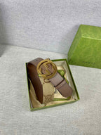 Gucci leather belt with GG canvas strap and gold-tone buckle in box