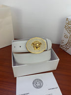 White leather belt with gold rhinestone oval lion buckle in storage box