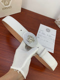 White leather belt with oval rhinestone lion buckle and perforated strap