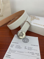 White leather belt with silver Medusa coin buckle and tan inner leather