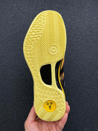 Outsole of black and yellow basketball shoe with textured tread
