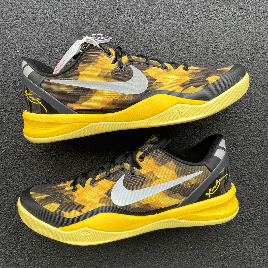 Black and yellow camo basketball shoe, white swoosh, yellow midsole