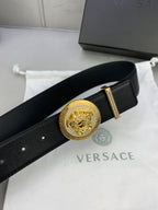 Versace black leather belt with gold medallion buckle and gold keeper bar