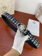 Black Versace belt with repeating white logo and silver Medusa oval buckle