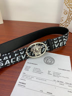 Black Versace belt with repeating white logo and silver Medusa buckle, side angle