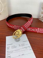 Versace belt loop with gold Medusa buckle on red logo strap placed on sales receipt paper.