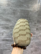 Single beige patterned slide sandal, front toe and stitched texture close-up