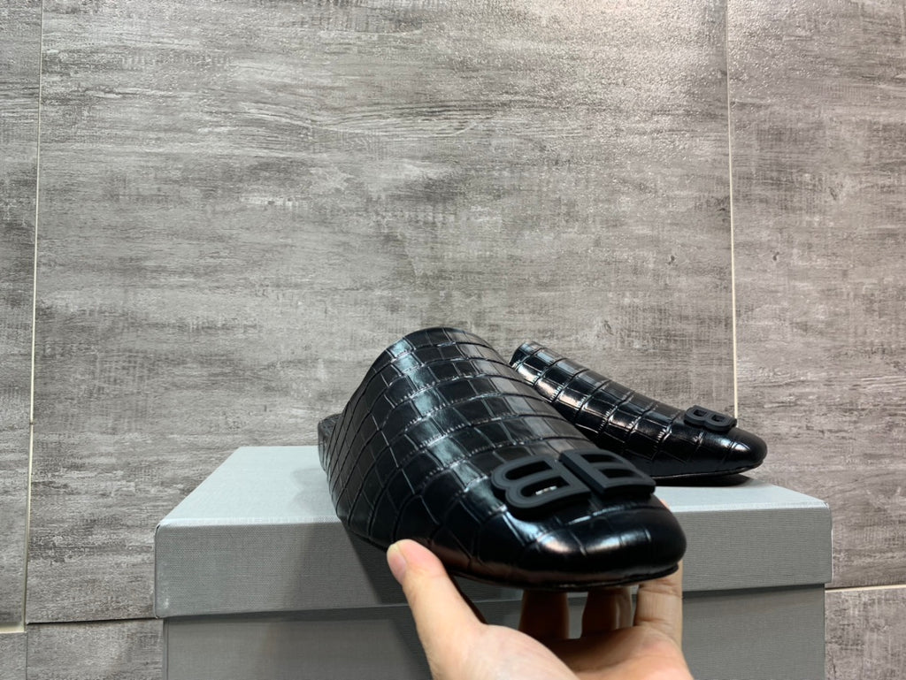 Black croc-embossed slide sandals with large BB logo on front