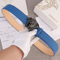 Versace belt in blue leather with silver lion-head buckle and tan interior lining.