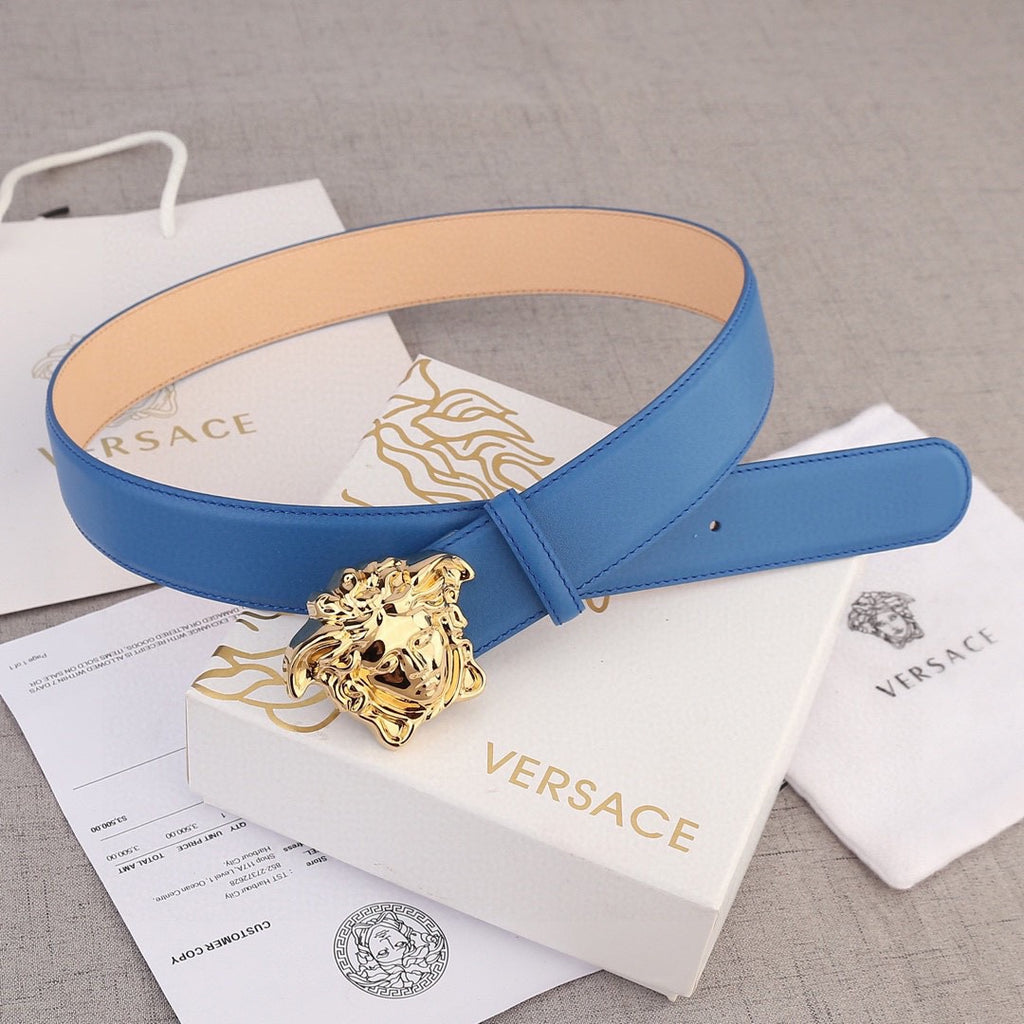 Versace belt in blue leather with gold lion-head buckle and tan inner lining.