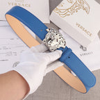 Versace belt in blue leather with silver lion-head buckle and tan interior lining.