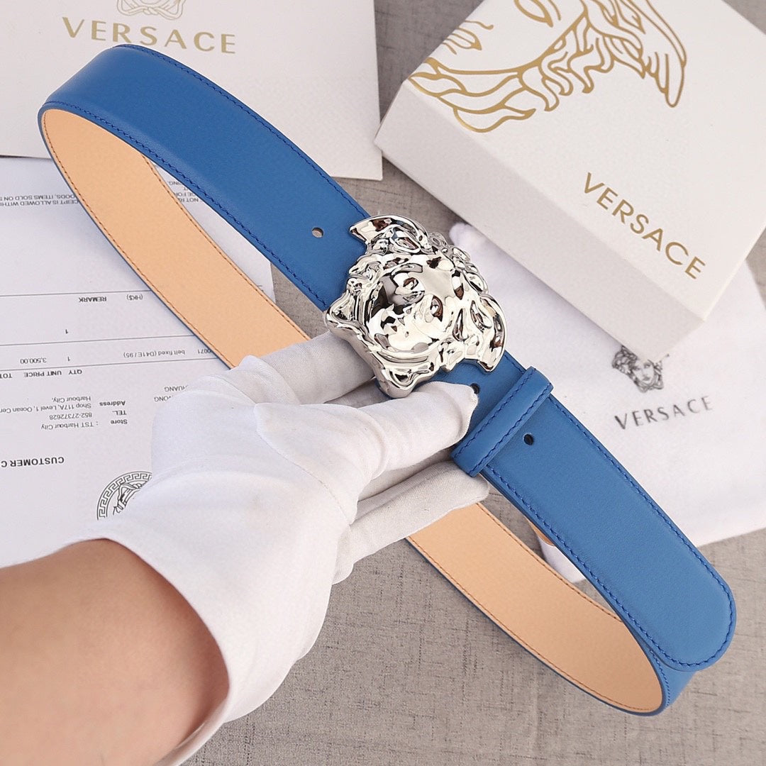 Versace belt in blue leather with silver lion-head buckle and tan interior lining.