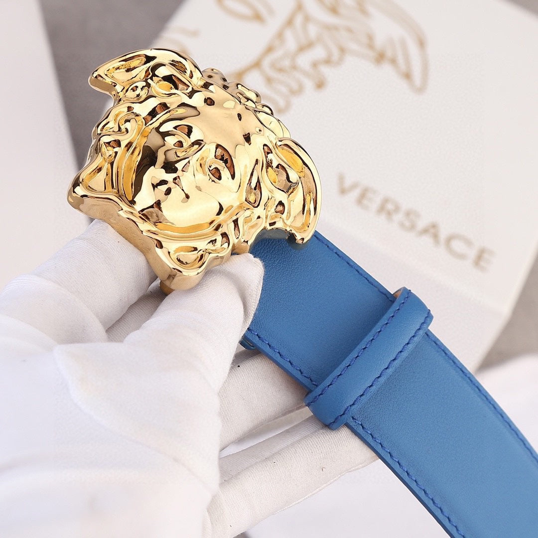 Versace belt with close-up gold lion-head buckle and blue leather strap.