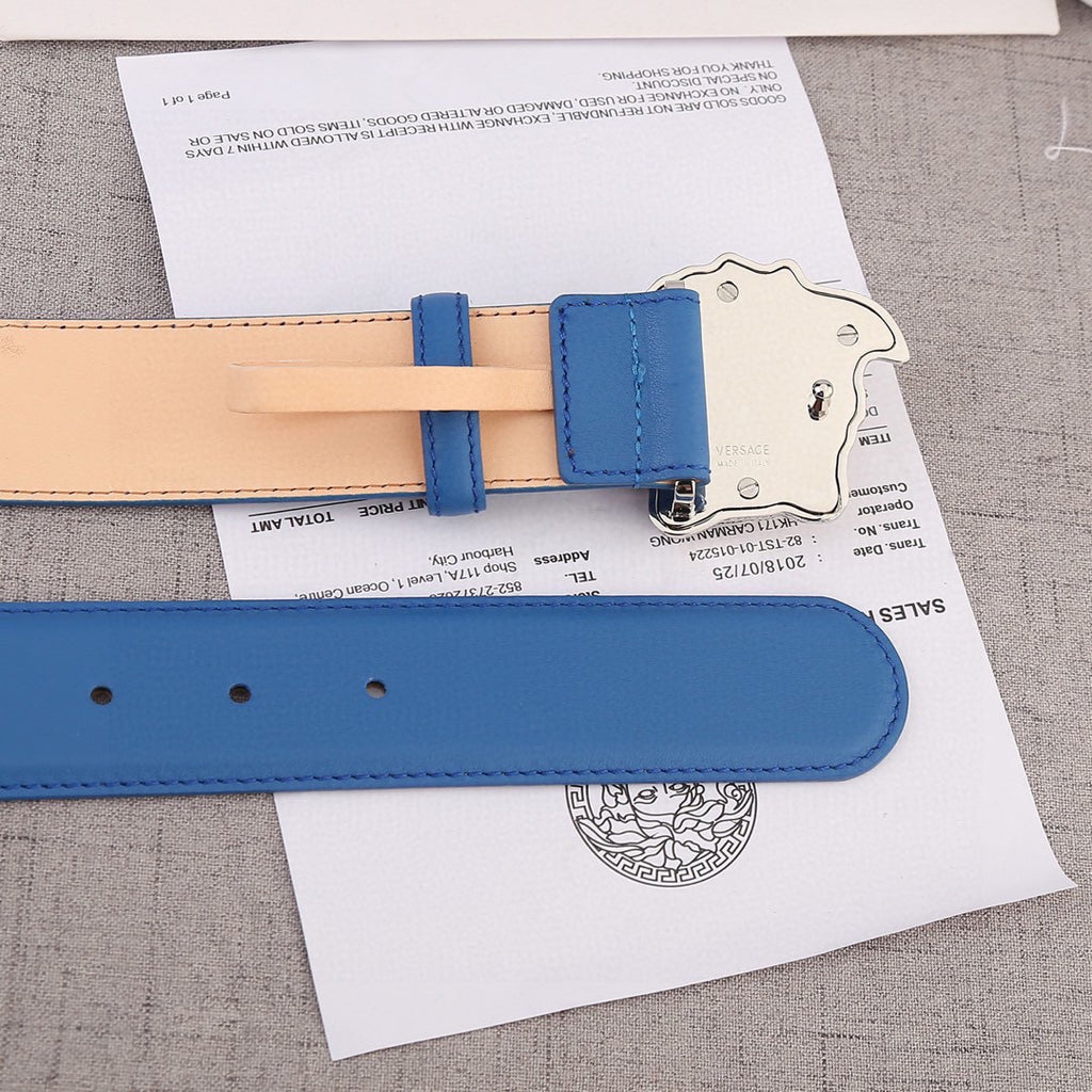 Versace belt in blue leather with tan underside, belt holes, and end tab.