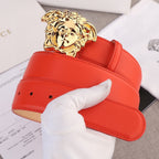 Versace belt with red leather strap and gold Medusa-style buckle detail