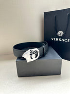 Versace leather belt, dark strap with silver logo buckle on box