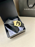 Versace leather belt, dark strap with gold logo buckle in open box