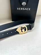 Versace leather belt, dark strap with gold logo buckle, front close-up