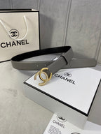 Leather belt with gray strap and gold-tone double C buckle, shown with packaging box