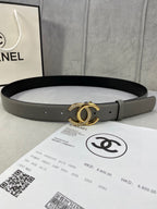 Two-tone leather belt with gold-tone double C buckle and small stud holes, dark gray finish