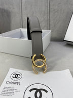 Leather belt with gold-tone double C buckle on gray strap, with black inner side