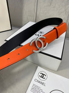 Orange leather belt with silver CC buckle and black fabric backing