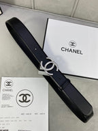 Black leather belt with silver-tone CC buckle on packaging