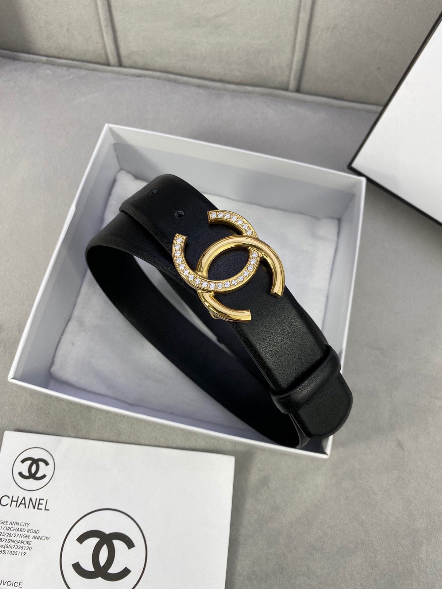 Black leather belt with gold-tone CC buckle in gift box