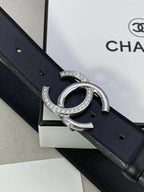 Dark blue leather belt with silver-tone CC buckle and crystals