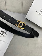 Black leather belt close-up of gold-tone CC buckle on strap
