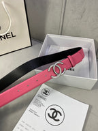 Chanel belt in pink with black underside and gold CC buckle, shown in gift box
