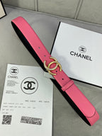 Chanel belt with pink strap and black reverse, gold CC buckle with rhinestone trim
