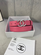 Pink leather Chanel belt with gold rhinestone CC buckle on white gift box