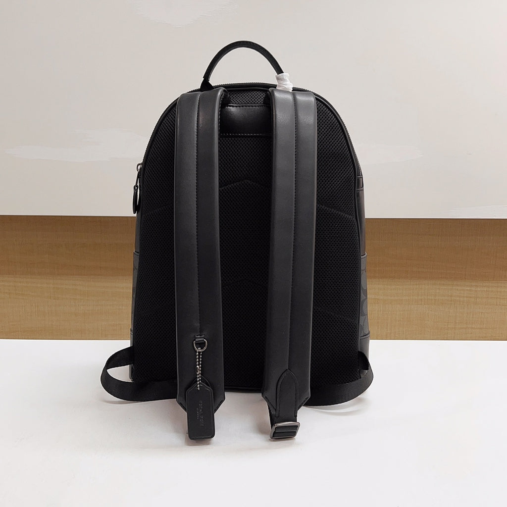 Coah backpack back view with adjustable shoulder straps and back tab